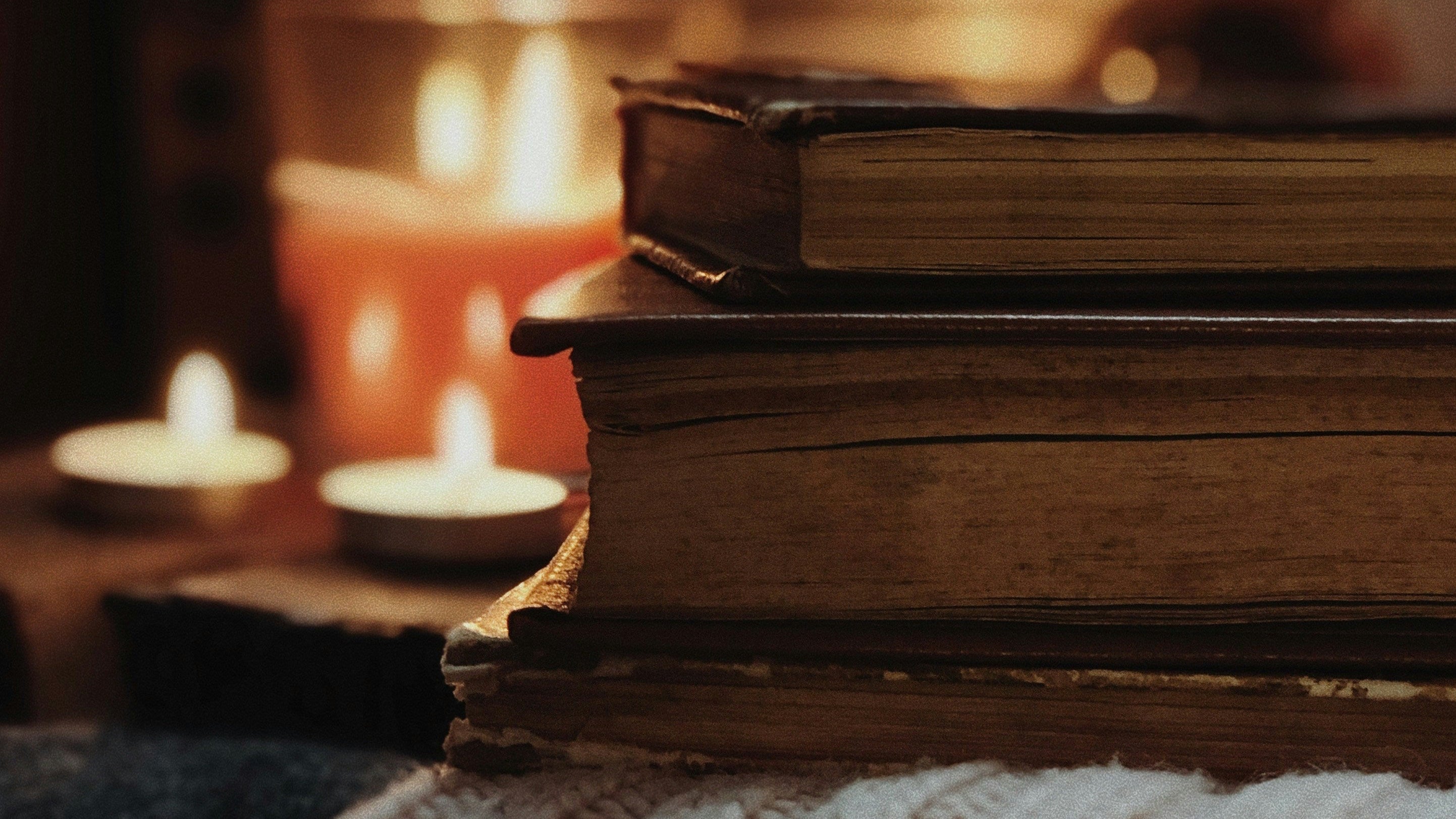 Stack of Books with Candles